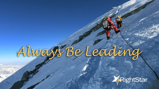 Silhouette person jumping over 2015 on the hill at sunset